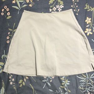 Girlfriend Collective High Waisted A-Line Sport Mini Skort in Sage Green
